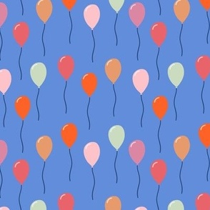 Colourful birthday balloons on blue