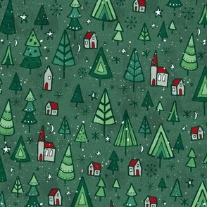 Snowy Christmas trees and houses on a green background 