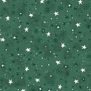 Stars and snow on a green background