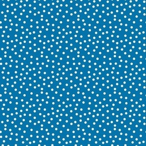 white polka dots on dark teal very small