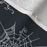 Funny spiders with cobwebs. White on ebony background