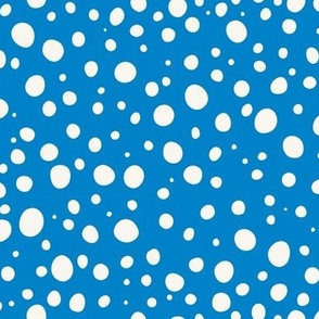 polka dots cream on bright light blue