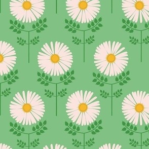 Medium-scale sweet daisy print in colors of golden yellow, pink, and green. 
