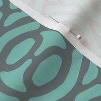 rotating geometric ovals - light teal and grey
