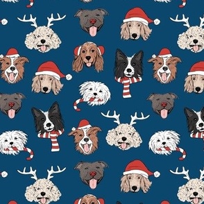 Christmas dogs - cute dressed up holiday puppies with antlers santa hats candy cane and sinter scarf and mittens on navy blue night 