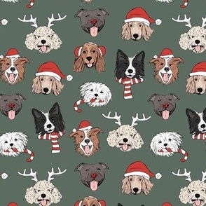 Christmas dogs - cute dressed up holiday puppies with antlers santa hats candy cane and sinter scarf and mittens on camo green 