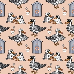 Seagull, beach hut, bucket & spade seaside pattern on warm beige.