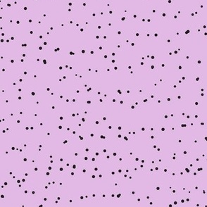 Black speckles on purple