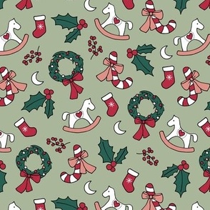 Cutesy Christmas retro wreath mistletoe candy cane moon rocking horse and stockings seasonal ornaments and icons red pink green blush on sage