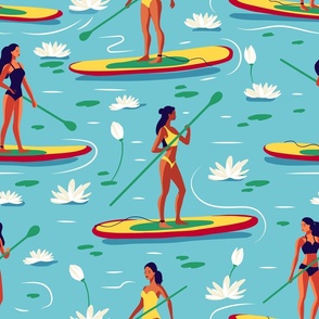 Woman in a swimsuit on a SUP board on the lake