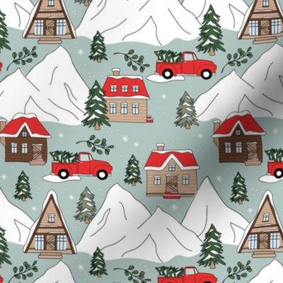 Vintage Christmas- Mountain cabins and christmas trees driving home for Christmas seasonal winter wonderland and snowy mountain peaks red on vintage blue
