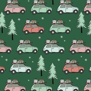 Vintage Christmas cars - driving home for christmas seasonal retro car design with christmas presents and snowflakes pink blush blue on pine green