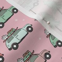 Vintage Christmas cars - driving home for christmas seasonal retro car design with christmas presents and snowflakes coral mint green on pink