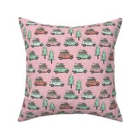 Vintage Christmas cars - driving home for christmas seasonal retro car design with christmas presents and snowflakes coral mint green on pink