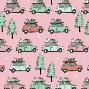 Vintage Christmas cars - driving home for christmas seasonal retro car design with christmas presents and snowflakes coral mint green on pink