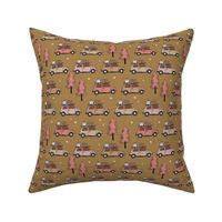 Vintage Christmas cars - driving home for christmas seasonal retro car design with christmas presents and snowflakes pink blush on moody ochre golden yellow