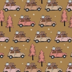 Vintage Christmas cars - driving home for christmas seasonal retro car design with christmas presents and snowflakes pink blush on moody ochre golden yellow