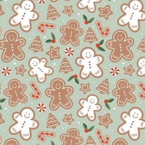 Retro cutesy gingerbread man - christmas cookies stars and trees and baked candy cane seasonal bakery snacks design red green beige on soft sage green
