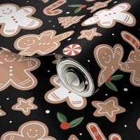 Retro cutesy gingerbread man - christmas cookies stars and trees and baked candy cane seasonal bakery snacks design red green beige on black night