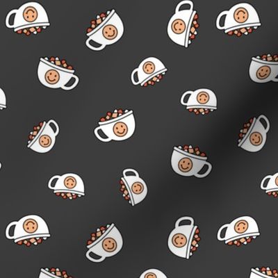 Cutesy Christmas hot chocolate and coffee cups and smileys with little marshmallows candy retro kids design on charcoal gray