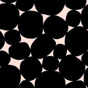 Big black circles on a beige background. Modern abstract texture