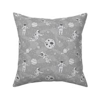 Astronauts in outer space light gray - cosmonauts exploring galaxies and planets - small scale 