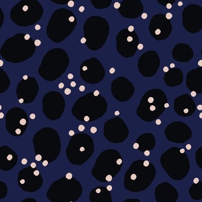 Abstract hand drawn design with black and white dots on a blue background