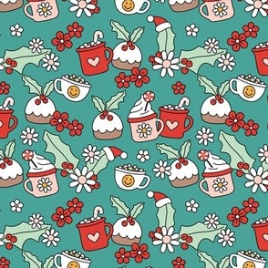 Christmas snacks - Smiley cups of hot chocolate coffee tea pudding anf retro flowers and mistletoe red mint on teal