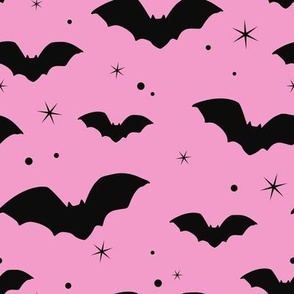 Bat silhouettes on a pink sky