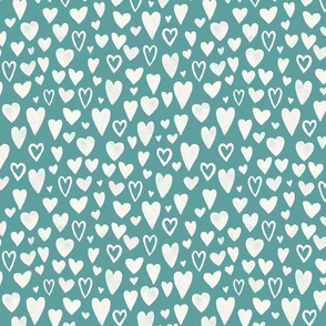hand drawn chalk hearts on solid turquoise  