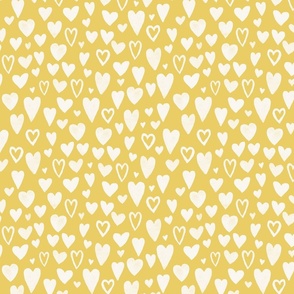 hand drawn chalk hearts on solid yellow