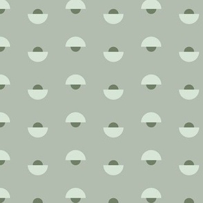 Green half circles with smaller dark green half circle arranged inversly in rows on light green background