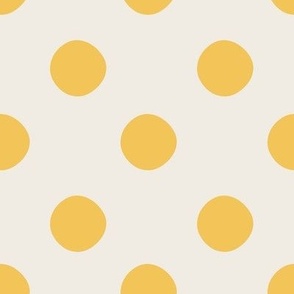 Large-Scale hand drawn polka dot design in colors of tan and golden saffron yellow.
