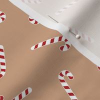 Christmas candy canes on brown 8x8