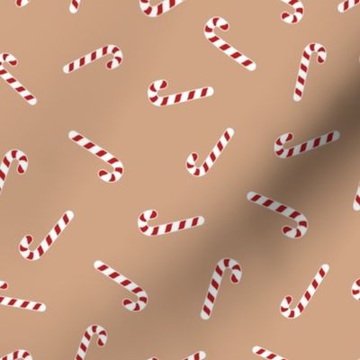 Christmas candy canes on brown 8x8