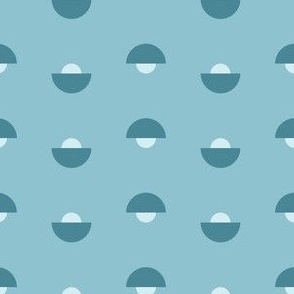 Blue half circles arranged inversely in rows on light blue monochromatic blue palette