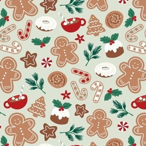 Christmas snacks collection - cutesy gingerbread cookies hot chocolate candy cane and pine branches christmas pudding donuts kids design ruby red green jade on mist