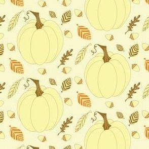 White pumpkins with autumn candy corn leaves and acorns 