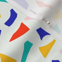 Bright abstract pattern with cut out shapes in red, blue, yellow, green and pink colours