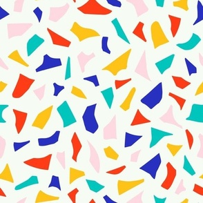 Bright abstract pattern with cut out shapes in red, blue, yellow, green and pink colours