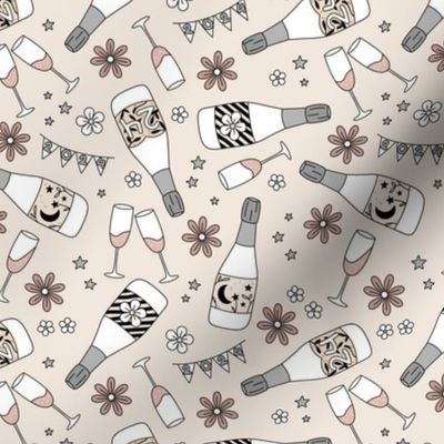 Happy Holidays new year's party - champagne bottles and glasses to toast on 2023 vintage boho style retro New year design beige gray on sand