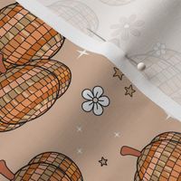 Retro autumn halloween party disco ball and flowers design - cute groovy vintage style pumpkins stars and blossom orange beige on tan