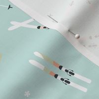 Winter adventures - minimalist style skies and snowflakes winter sport ski resort theme sage green peach orange on sea foam green