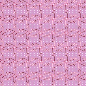 Christmas Holiday Candy Cane Pattern on Pink Background
