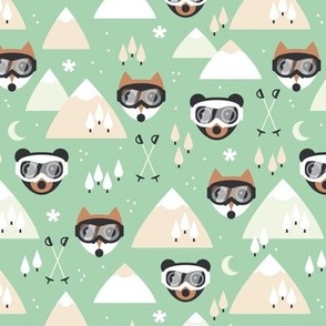Winter adventures - Foxes and bears with retro ski goggles mountains pine trees snowflakes skies and moon design for kids burnt orange sand on mint green