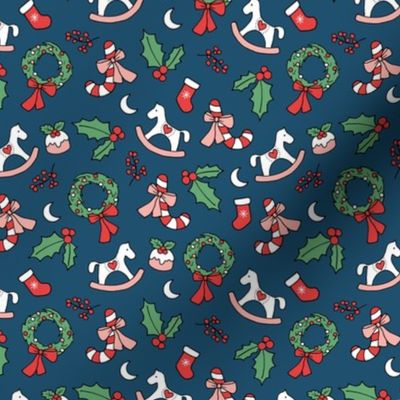 Cutesy Christmas retro wreath mistletoe candy cane pudding moon rocking horse and stockings seasonal ornaments and icons blush red green on navy blue