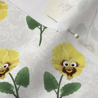 Cute Yellow Pansy Flowers with Faces on Cream Texture