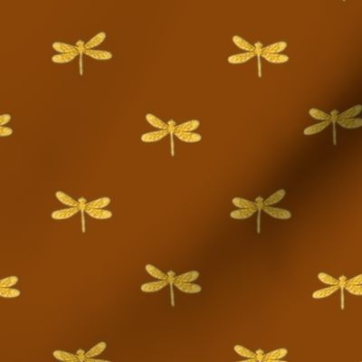 gold dragonfly on cinnamon 