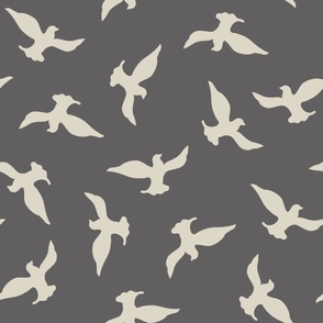 (XL) beige birds flying in the dark grey sky