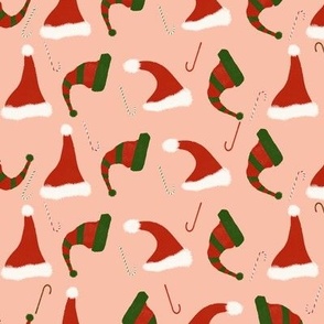 Santa and elf hats with candy cane on soft pink // 10”